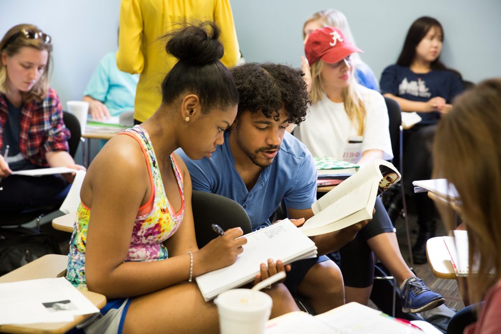 Students read a textbook