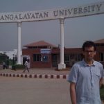 Nathan Loewen standing in front of Mangalayatan University, Aligarh, U.P.