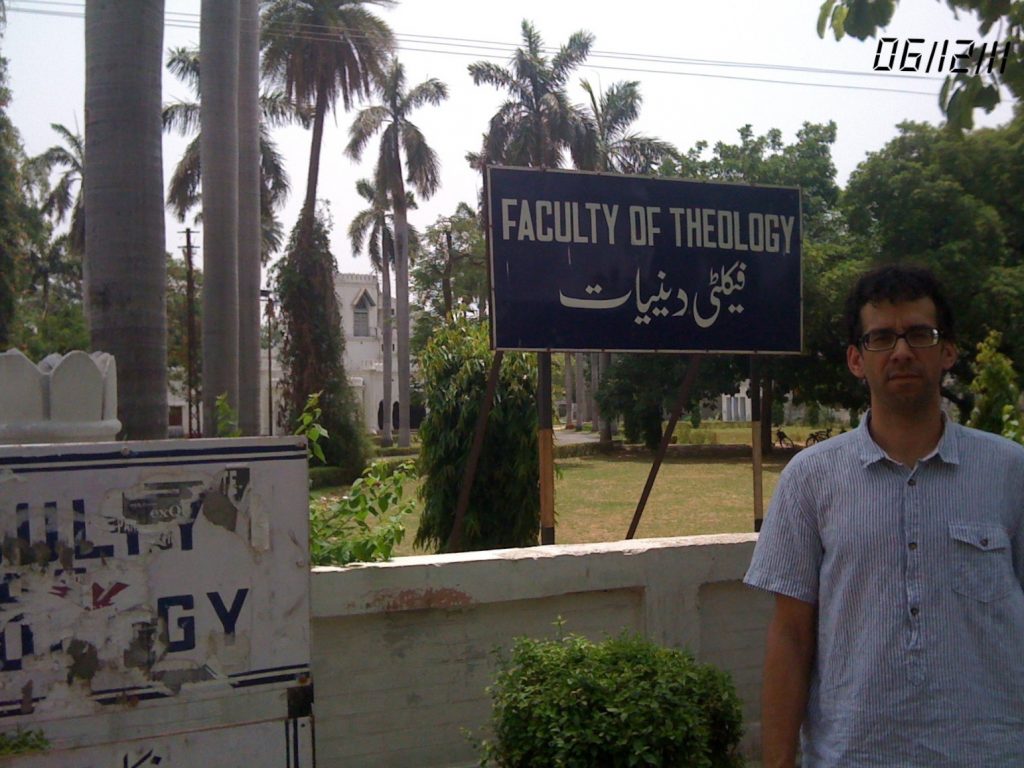 Nathan Loewen standing in front of Aligarh Muslim University
