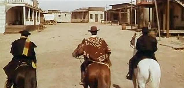 Three bandits enter a town in a scene from "Vado... l'ammazzo e torno" (1967)