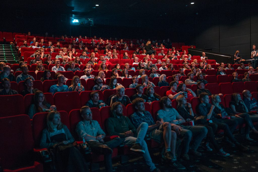 seated people in a large movie theatre
