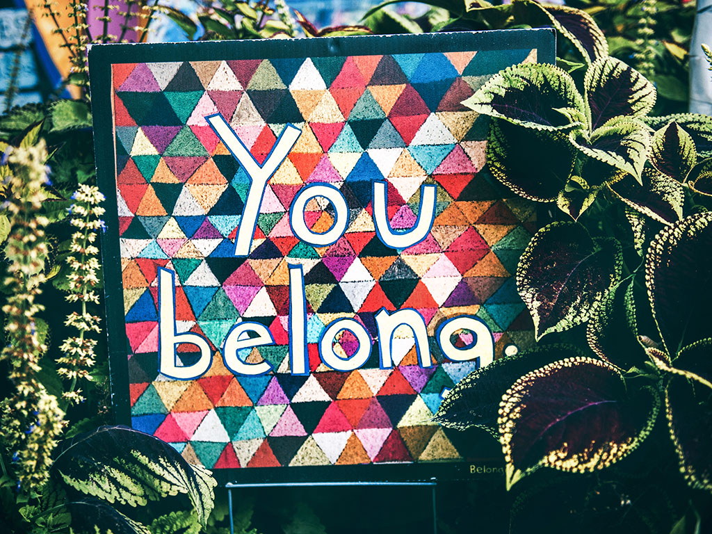 A quilted sign saying "you belong here."